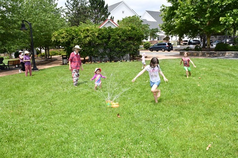 Kids Dancing in Sprinklers